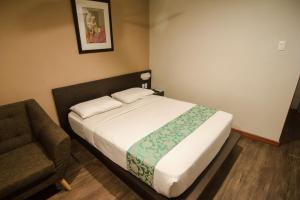 Postel nebo postele na pokoji v ubytování DG Grami Hotel