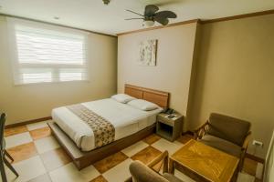 Кровать или кровати в номере DG Grami Hotel