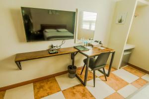 TV a/nebo společenská místnost v ubytování DG Grami Hotel