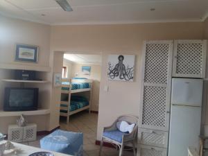 Un televizor și/sau centru de divertisment la BELLEVUE RESORT Flat No 9