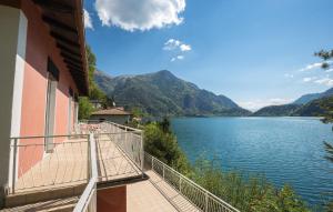 a balcony of a house with a view of a lake at Villa Belli in Ledro