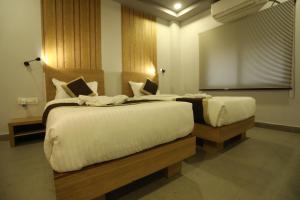 Postelja oz. postelje v sobi nastanitve VIPs Hotel Olive