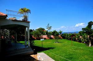 a view of a yard of a house at Victoria Lake View Guesthouse & Safaris in Entebbe