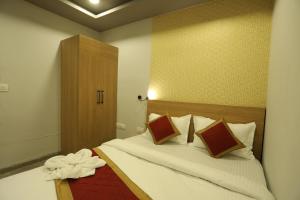 Postelja oz. postelje v sobi nastanitve VIPs Hotel Olive