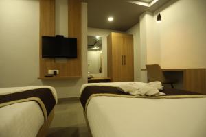 TV in/ali zabaviščno središče v nastanitvi VIPs Hotel Olive