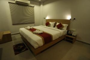 Postelja oz. postelje v sobi nastanitve VIPs Hotel Olive