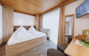 Ein Bett oder Betten in einem Zimmer der Unterkunft Pension Zimpasser