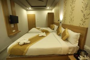 Postelja oz. postelje v sobi nastanitve VIPs Hotel Olive