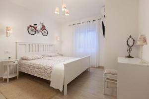 Postel nebo postele na pokoji v ubytování APARTMANI Mirona - Tučepi