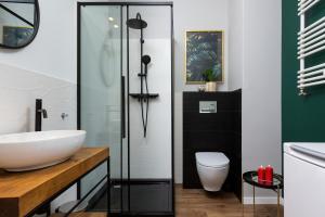 Kúpeľňa v ubytovaní Apartment Jana Kazimierza Wola by Noclegi Renters