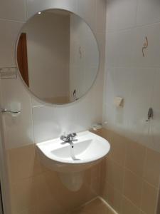 a bathroom with a sink and a mirror at Studio Villa Park 408 in Borovets +11 photos