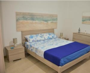 Ein Bett oder Betten in einem Zimmer der Unterkunft SALENTO d' aMARE