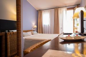 Postel nebo postele na pokoji v ubytování Hotel Cetarium