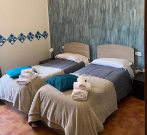 Postel nebo postele na pokoji v ubytování ALBERGO 900Strati