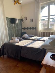 Postel nebo postele na pokoji v ubytování ALBERGO 900Strati