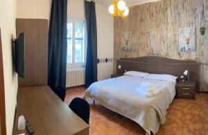 Postel nebo postele na pokoji v ubytování ALBERGO 900Strati