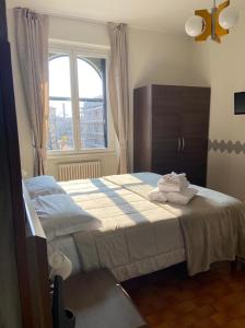 Postel nebo postele na pokoji v ubytování ALBERGO 900Strati