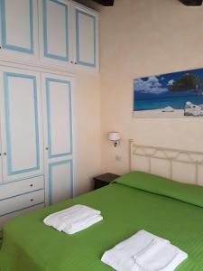 Krevet ili kreveti u jedinici u okviru objekta Rotondo Residence - Simar Vacanze