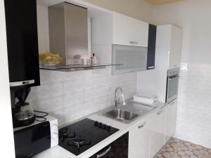 Kuchyňa alebo kuchynka v ubytovaní Apartment Summer Dreams