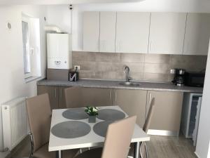 A kitchen or kitchenette at Elena-Maria Apartments