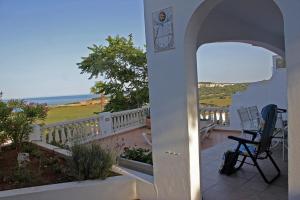 a view of a balcony with a table and chairs at Gerry&Lotti Apartment in Son Bou