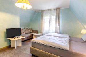 TV a/nebo společenská místnost v ubytování Hotel-Restaurant Ochsen
