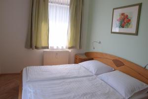 Voodi või voodid majutusasutuse Buchenheim Apartments toas