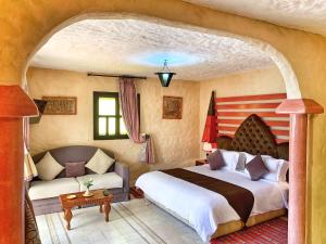 Postel nebo postele na pokoji v ubytování Riad Al Madina