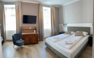 Katil atau katil-katil dalam bilik di Urban Stay Salzburg City