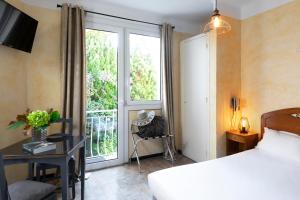 Postel nebo postele na pokoji v ubytování Hotel Marengo