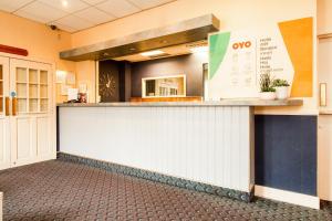 an empty lobby with a counter and aasteryasteryasteryasteryasteryasteryasteryastery at Cardiff Riverside Hotel by Belvilla in Cardiff