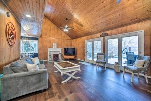 a living room with a couch and a fireplace at Hot Tub Secluded Hideaway on Sleepy Hollow Lake in Athens
