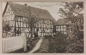 a black and white photo of two houses at Historisches Haus Unkelbach in Irlenborn
