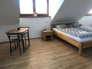 Posteľ alebo postele v izbe v ubytovaní Penzion U Kostela