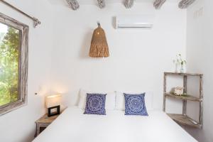 Postel nebo postele na pokoji v ubytování Holbox Dream Beachfront Hotel