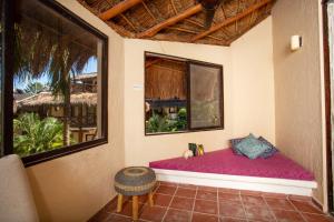 Postel nebo postele na pokoji v ubytování Holbox Dream Beachfront Hotel + 37 fotografií