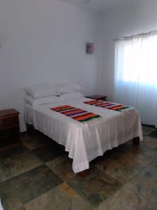 Un pat sau paturi într-o cameră la Aventuras Mex Y Can