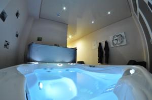 a bathroom with a large tub in a room at Appartement Studio Tournai in Tournai