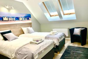 Ένα ή περισσότερα κρεβάτια σε δωμάτιο στο Apartamenty ELITMAT