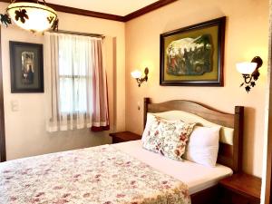 Letto o letti in una camera di Ada Bacchus Hotel