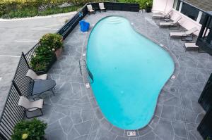 an overhead view of a swimming pool on a patio at Hofsas House Hotel in Carmel