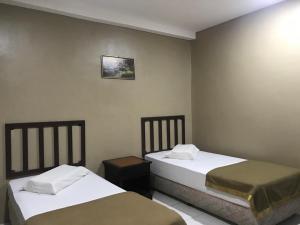 Кровать или кровати в номере Hotel Nawar