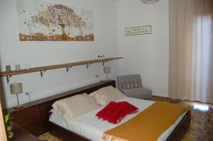 Appartamento da Nonna Pina tesisinde bir odada yatak veya yataklar