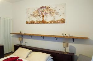 A bed or beds in a room at Appartamento da Nonna Pina