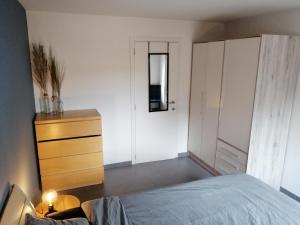 Un pat sau paturi într-o cameră la Le Renard