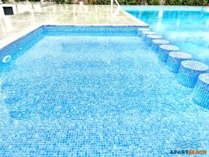 Bazén v ubytování APARTBEACH ADRIATICO 518 VISTAS PLAYA y CLIMATIZADO nebo v jeho okolí