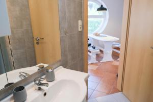 Kúpeľňa v ubytovaní Alexandra Apartman Sárvár + 37 fotografií