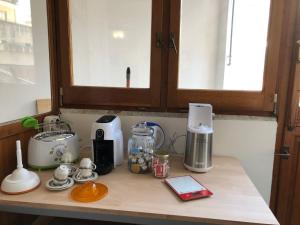 a kitchen counter with various appliances on it at Araba Fenice in Reggio Calabria