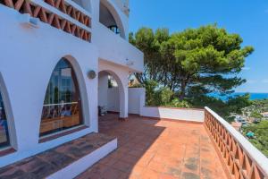 a house with a balcony with a view of the ocean at ST-37 BEGUR SA TUNA 2 Pax in Begur