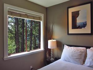 a bedroom with a bed and a large window at Gondola Lodge with Free Beach Voucher in South Lake Tahoe +167 photos